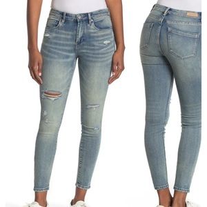 Distressed light denim jeans
